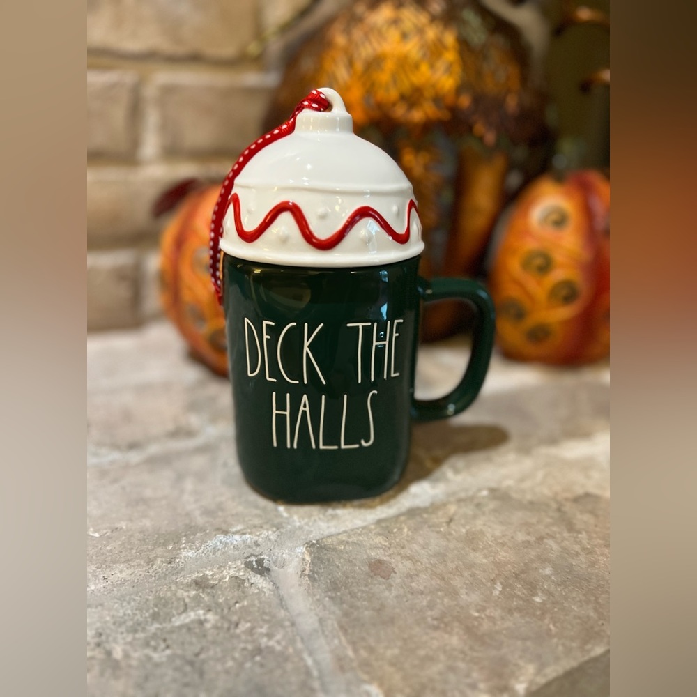 Rae Dunn Deck the Halls coffee mug with topper. New, never used.